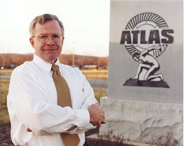 rich in front of atlas