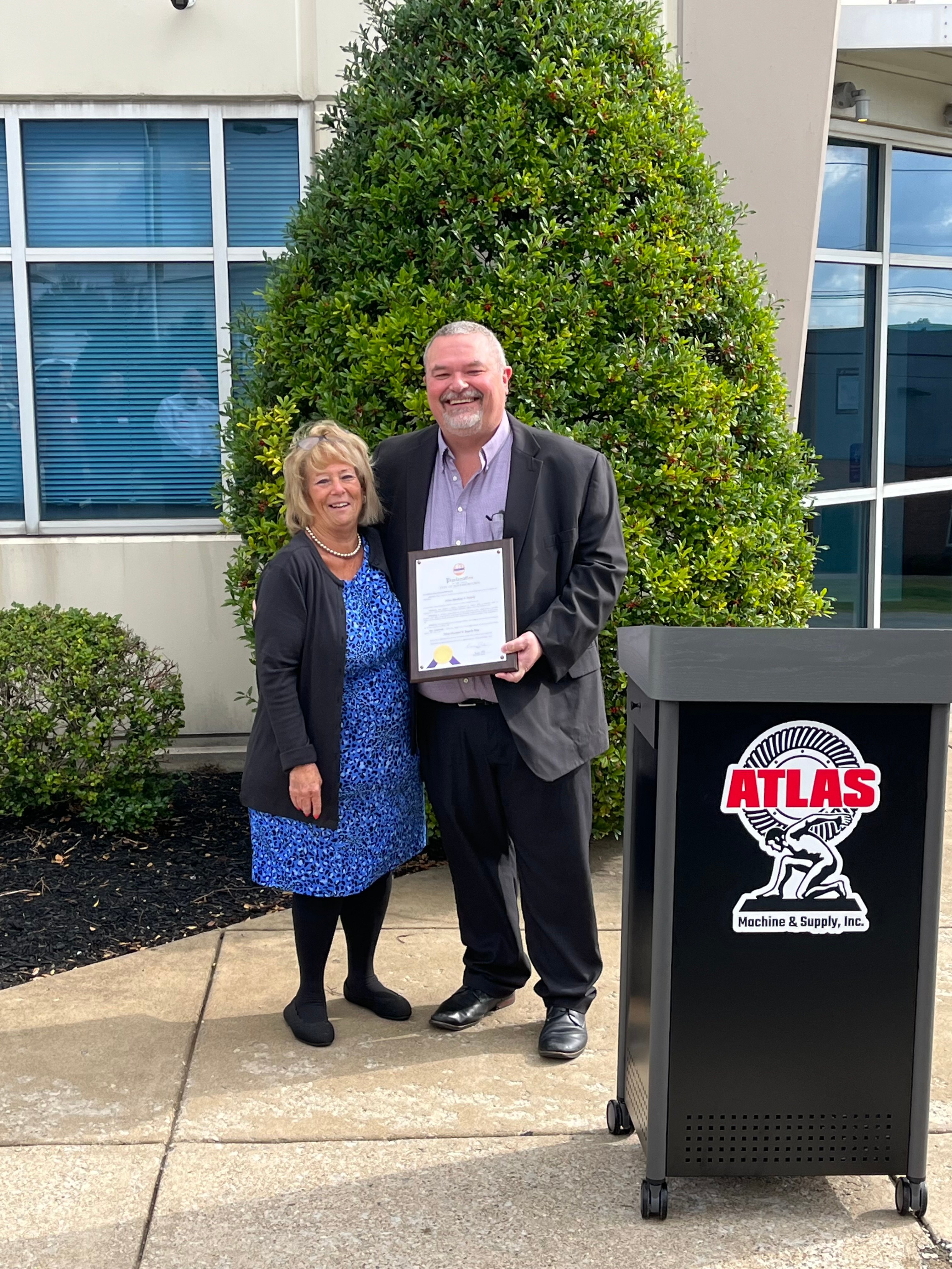 President, Dave Sullivan, and Mayor Carol Pike give proclamation at new facility.